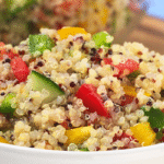 Bowl of cooked quinoa mixed with vegetables